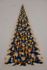 A Christmas tree decorated with doll's heads, for The Nutcracker